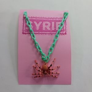 Aqua Plastic Link Orange Spider Necklace with Yellow Rhineston Eyes.
